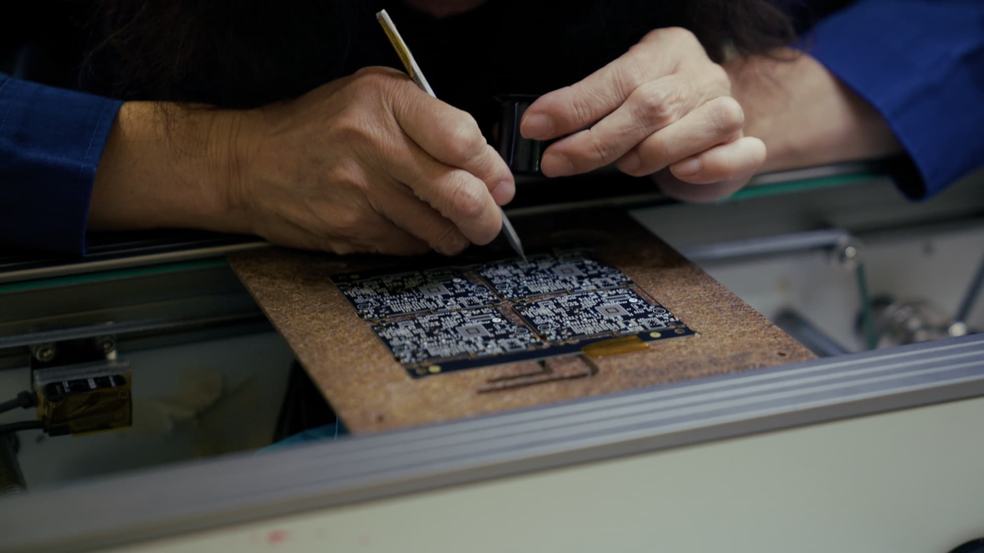 Foreseeson technician inspecting an assembled board